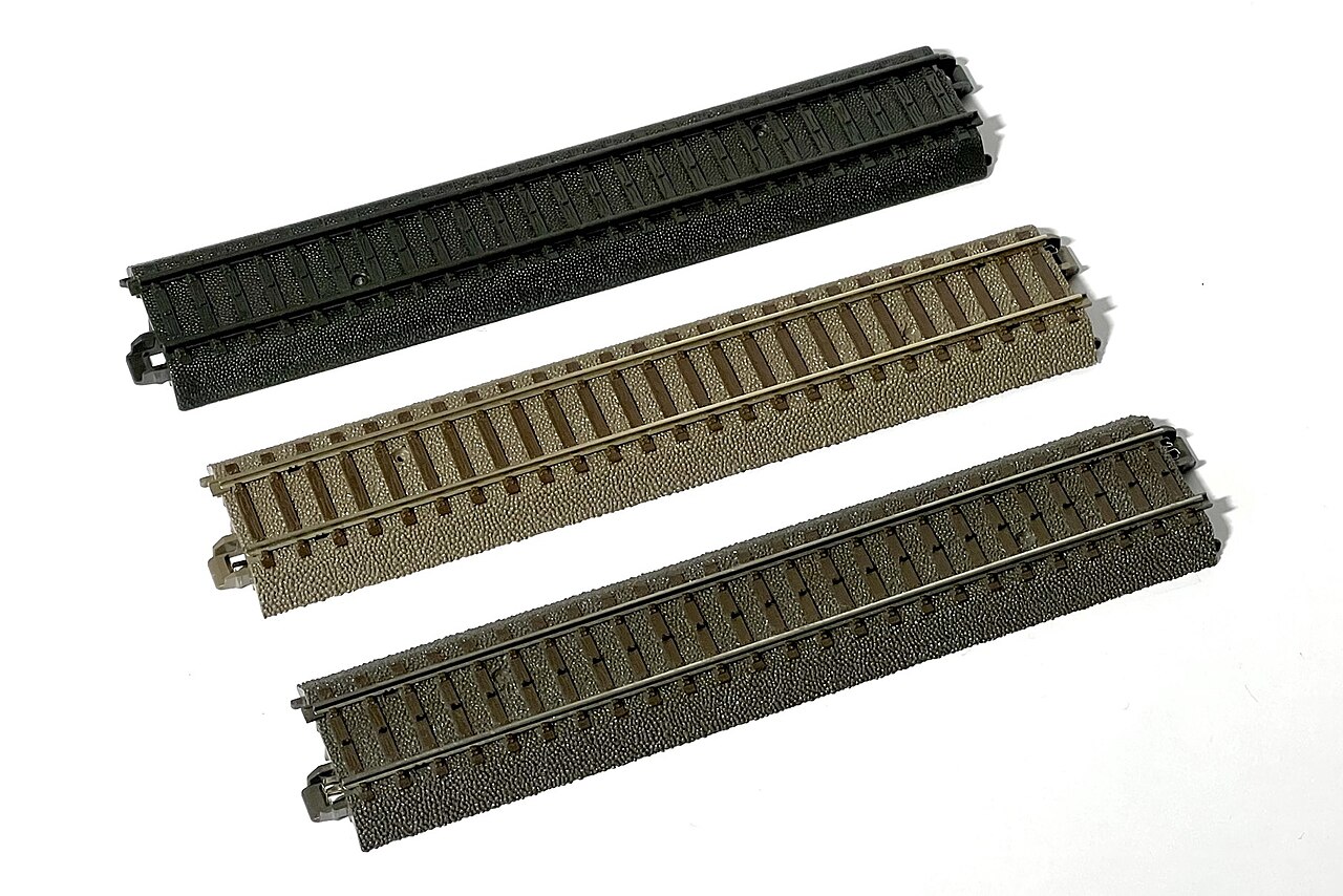 Three straight track pieces of the same 188.3 mm length side by side
